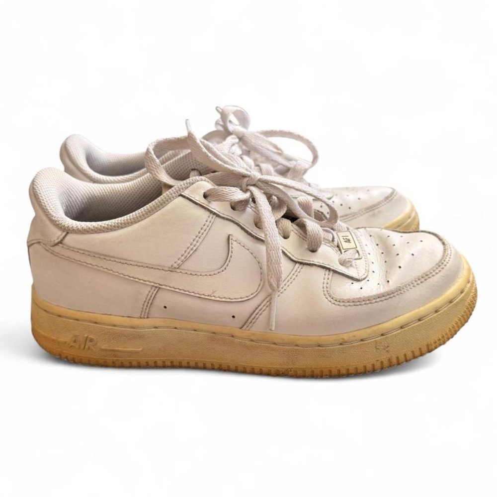 Nike Air Force 1 Low Sneakers in a Triple White Colorway feat.distinct aged sole